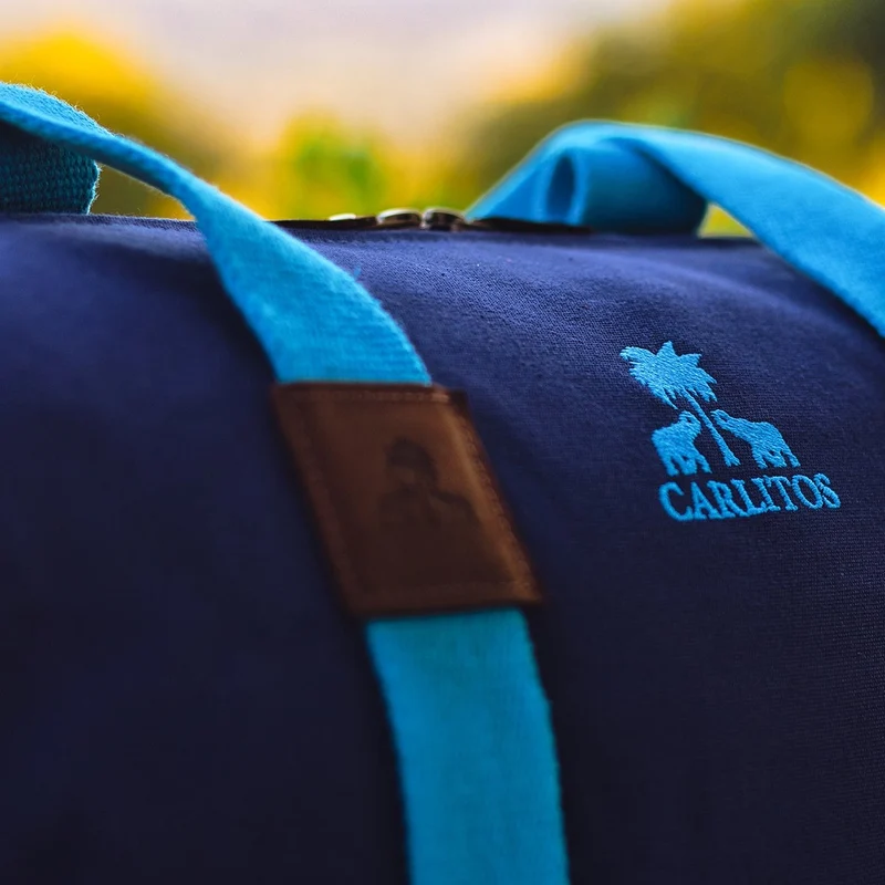 Dufflebag -M- NAVY mit türkisem Gurtband